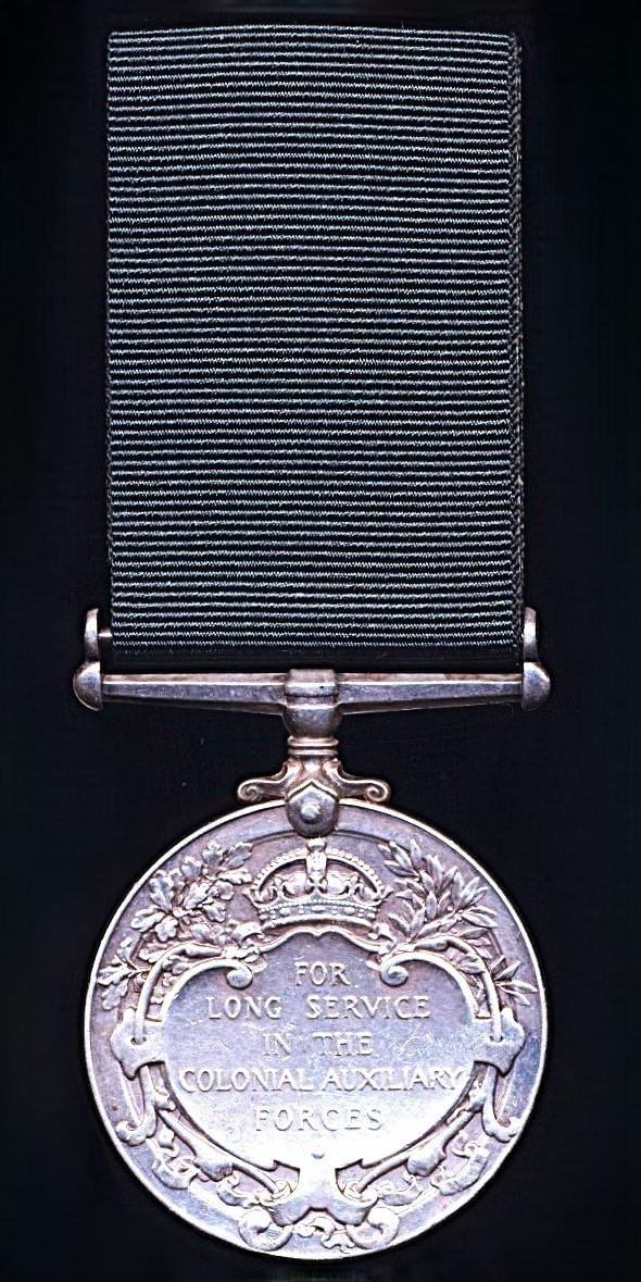 Colonial Auxiliary Forces Long Service medal. GV first issue, with swivel suspender (No. C.Q.M.Sjt. James Jayawardena, Ceylon L.I.)