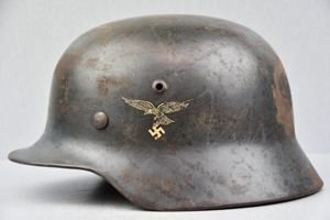 Early M35 Luftwaffe double decal steel helmet with droop tail eagle ET64 1938