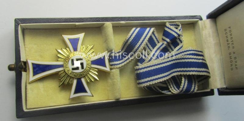 'Ehrenkreuz der deutschen Mutter - erste Stufe' (or mothers'-cross in gold) that comes stored in its original and/or neatly maker- (ie. 'Forster & Graf - Schäb. Gmünd'-) marked etui as issued and/or recently found