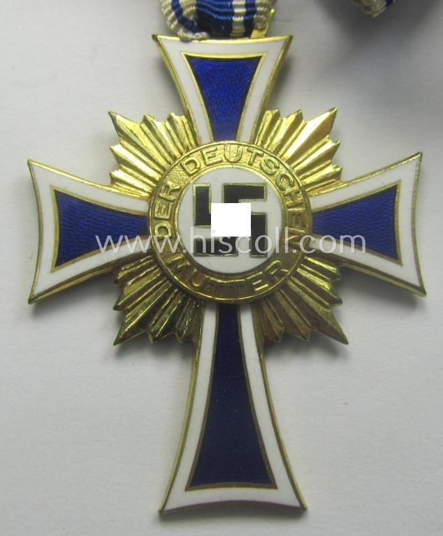 'Ehrenkreuz der deutschen Mutter - erste Stufe' (or mothers'-cross in gold) that comes stored in its original and/or neatly maker- (ie. 'Forster & Graf - Schäb. Gmünd'-) marked etui as issued and/or recently found