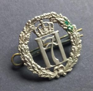 A superb and difficult to find (British made) Norwegian Free Forces Haakon 7 NCO's capbadge