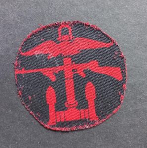 A perfect - left facing - regrettably single and cut down printed Combines Operation formation badge
