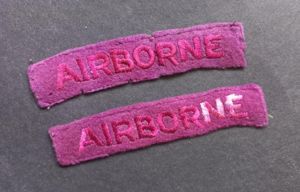 A great example of a - full matching (unfortunately washed) - issued set of embroided Airborne strips