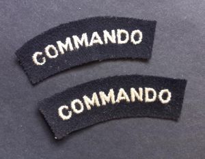 A neat example of a - full matching set - mid war period so called 'block type' lettering Commando white on black shoulder titles