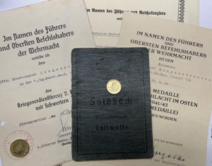 Soldbuch/citation grouping - Luftwaffe - Luftgau-Nachrichten Rgt.28 - Italy - Langenstrassen