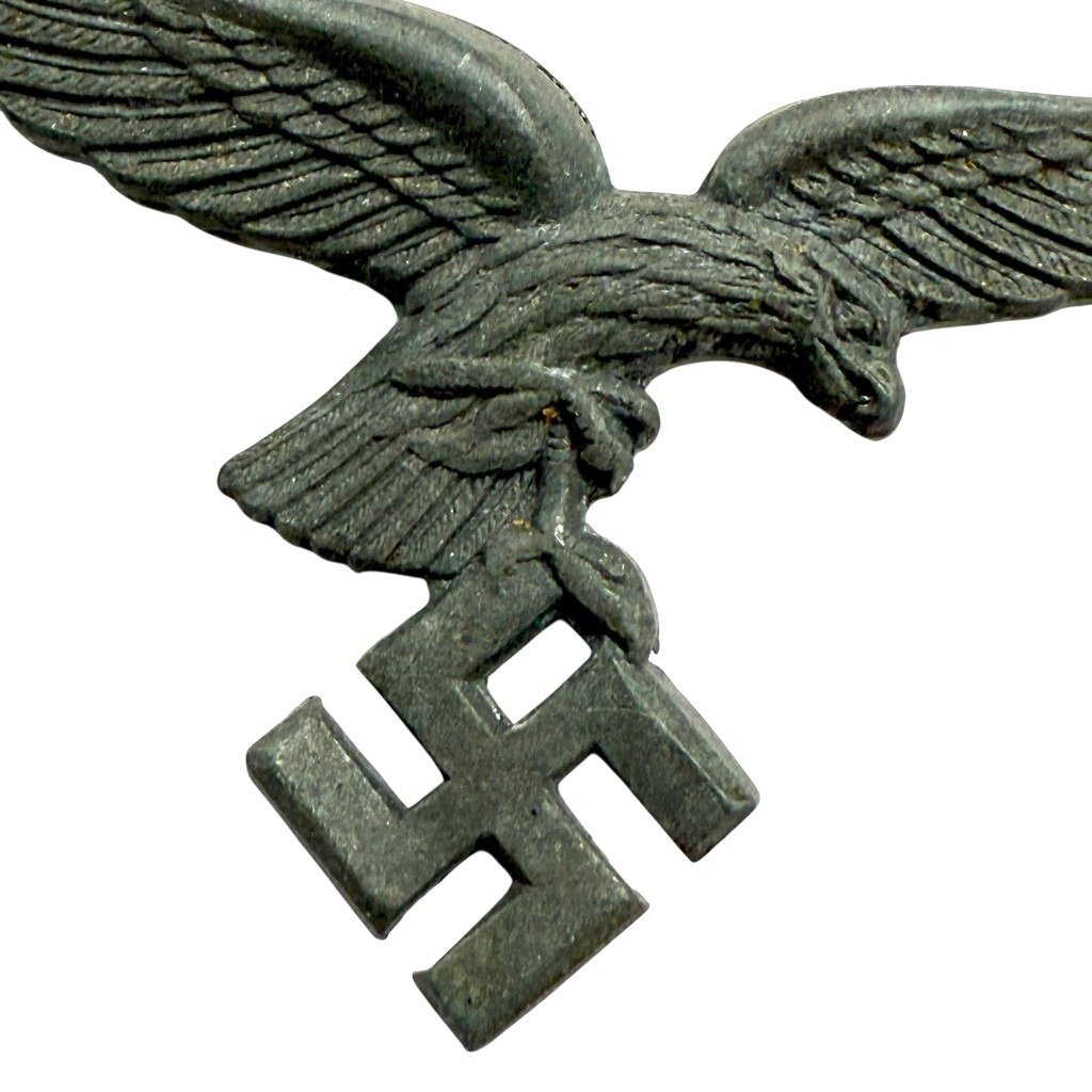 Original WWII German Luftwaffe metal visor cap eagle insignia