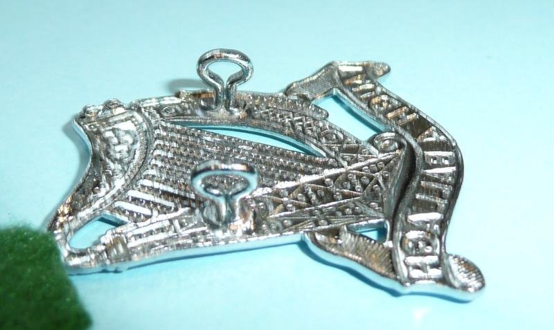 South African Irish Regiment Chromed Headdress Badge on Green Felt Badge Backing