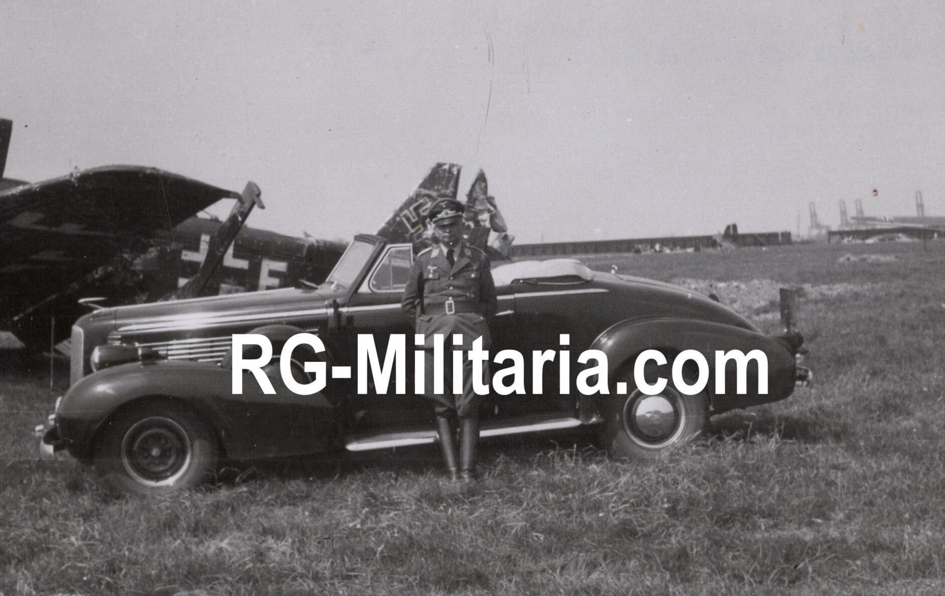 Original WW2 German Photo - German soldier with car on Rotterdam airfield Waalhaven with a destroyed Junkers JU 52 airplane, Holland (1940)