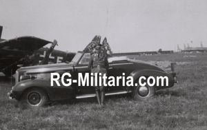 Original WW2 German Photo - German soldier with car on Rotterdam airfield Waalhaven with a destroyed Junkers JU 52 airplane, Holland (1940)