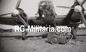 Original WW2 German Photo - Heinkel He 111 loading bombs at Fliegerhorst Schiphol, Amsterdam (1940)
