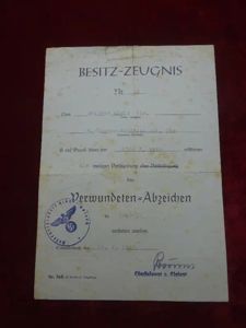 Diplôme badge des blessés classe noir accompagné de documents après guerre.