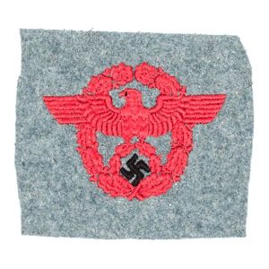 41A2U Police eagle embroidered in maroon and black threads on section of police green colored wool