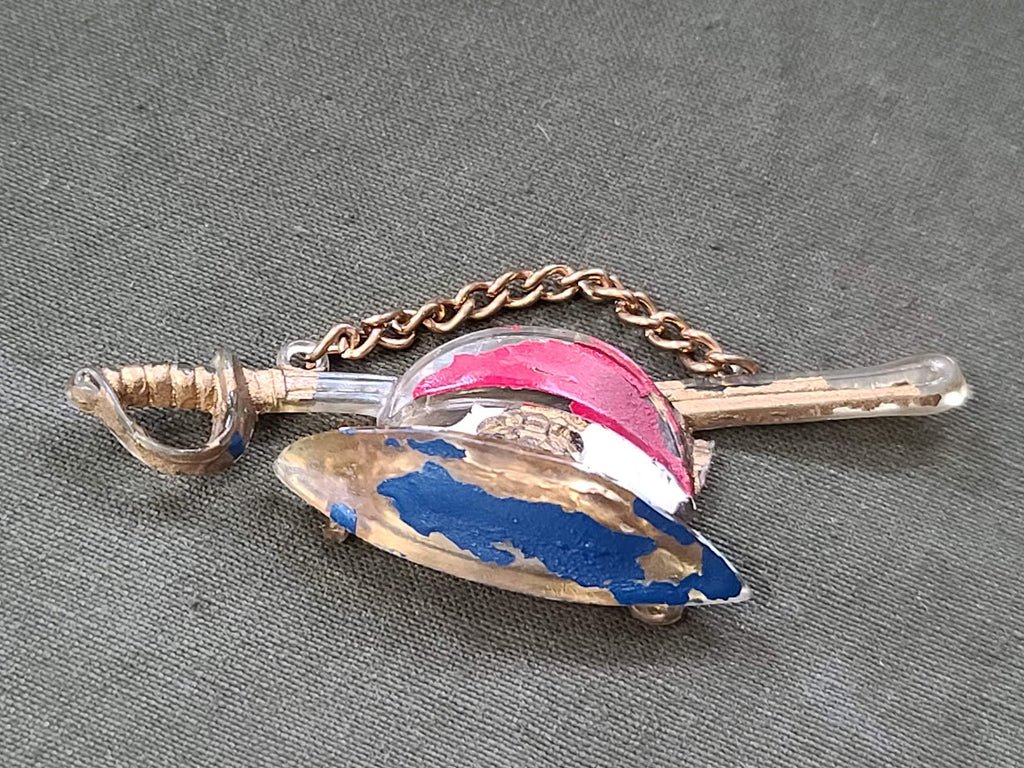 Early Plastic Hat and Sword Pin — image 3