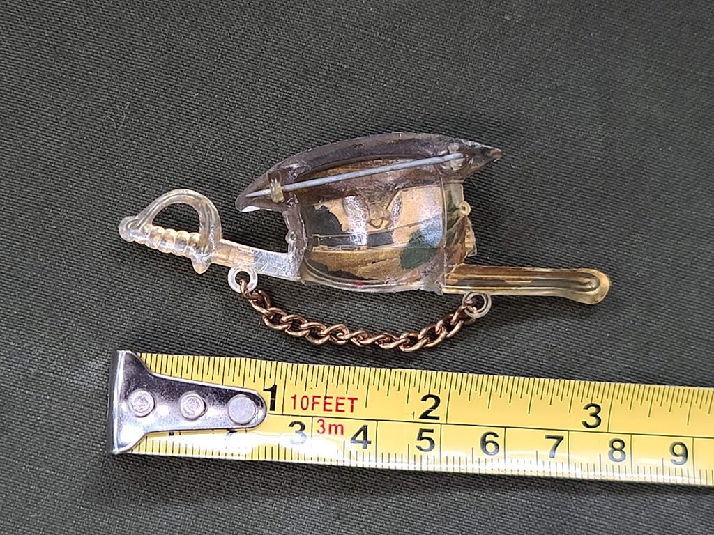 Early Plastic Hat and Sword Pin — image 4