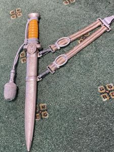 A FINE EXAMPLE OF A RED CROSS OFFICERS DAGGER WITH HANGERS AND KNOT.
