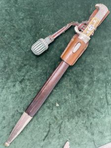 A LONG RURAL POLICE BAYONET BY ALCOSO WITH FROG AND PORTEPEE.